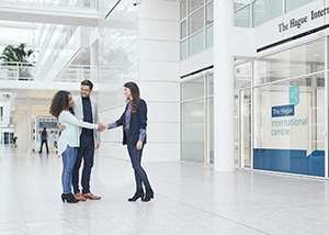 Personnel welcomes a couple to The Hague International Centre