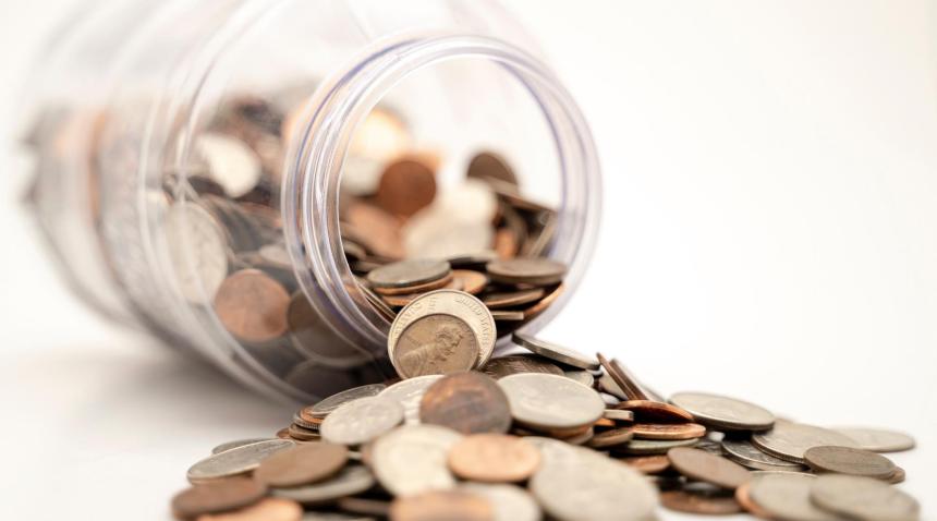 Coins spilling jar