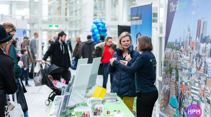 People at a booth at the Feel at Home fair