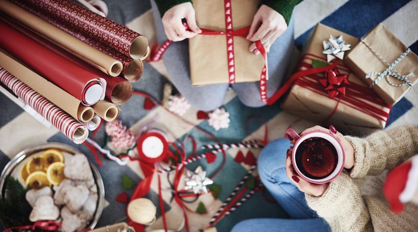 People wrapping Christmas gifts