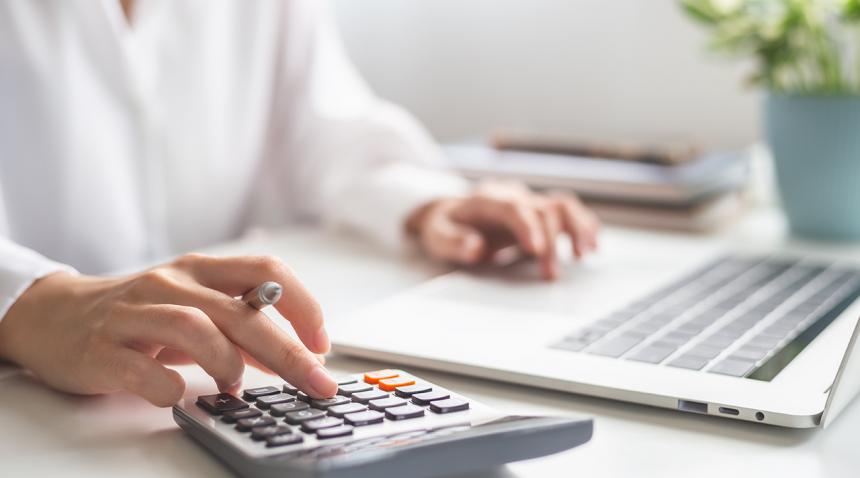 woman with laptop and calculator