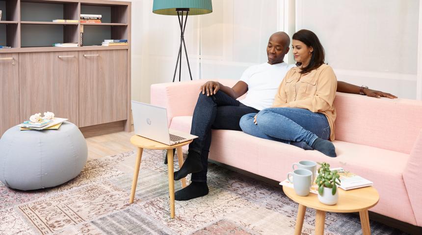 A couple watching a webinar