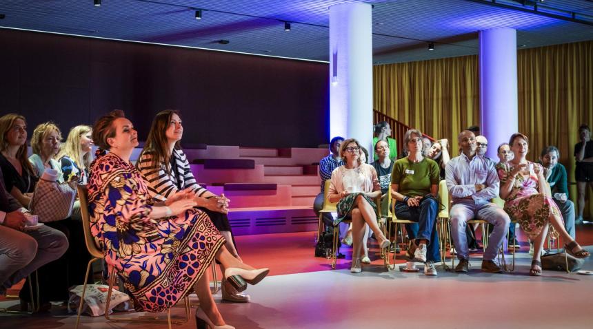 People listening at an event