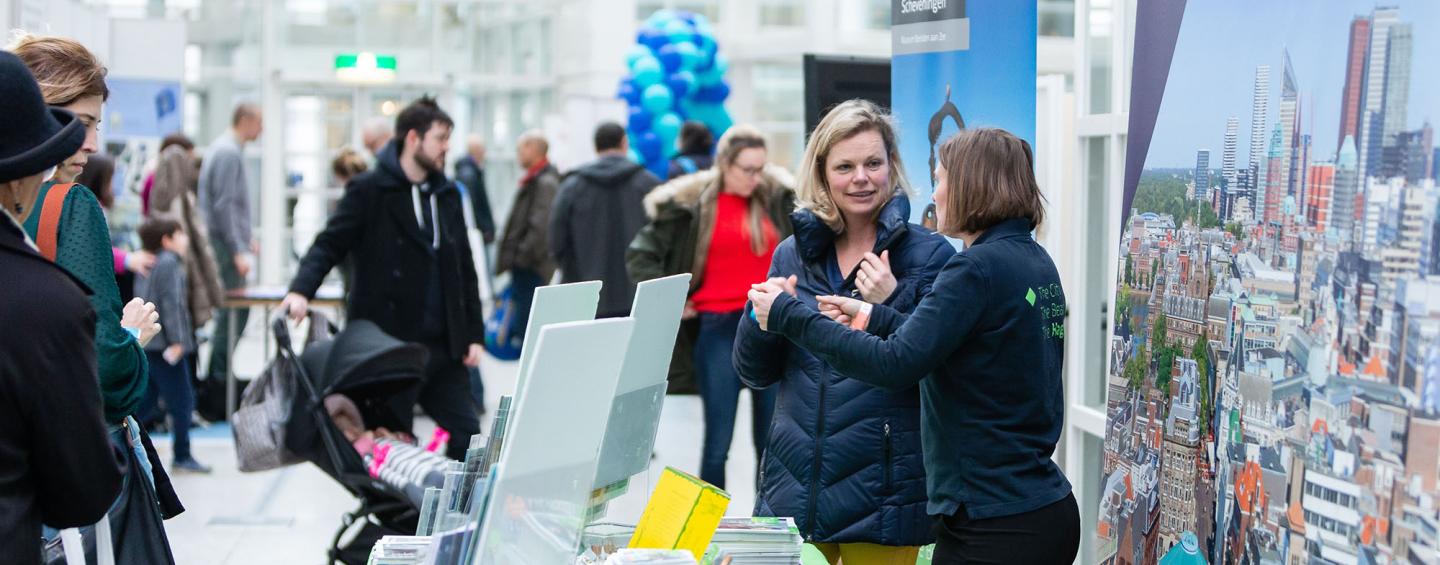 People at a booth at the Feel at Home fair