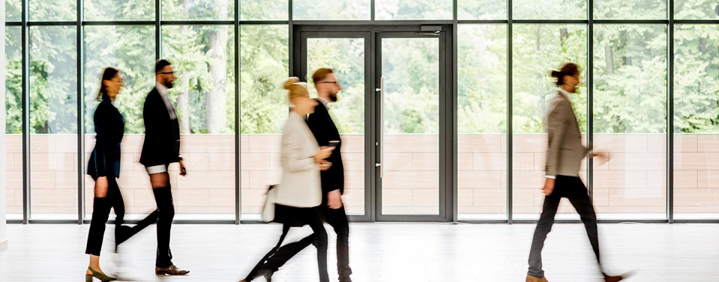 Working people walking in a building