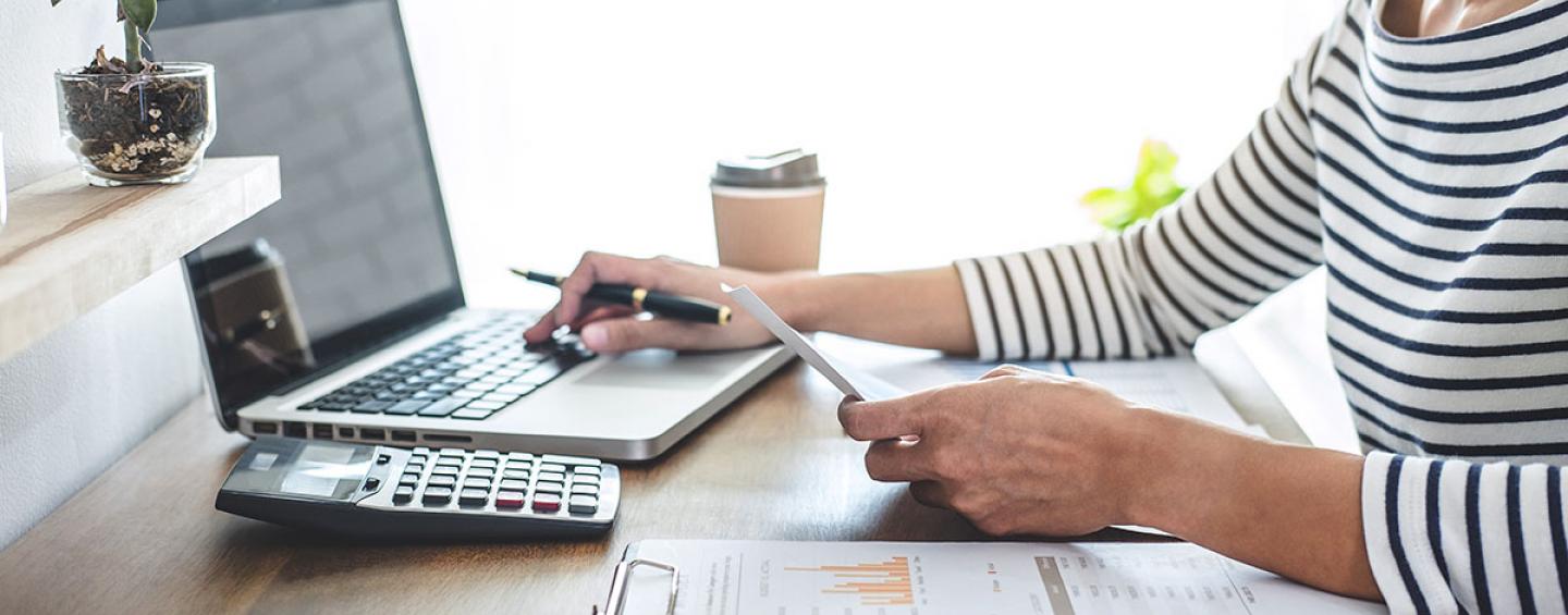 woman with phone and calculator