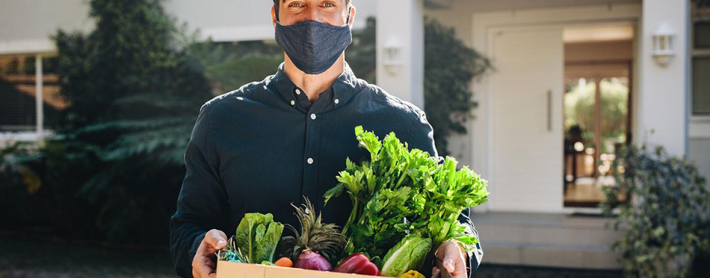 Delivery man with groceries