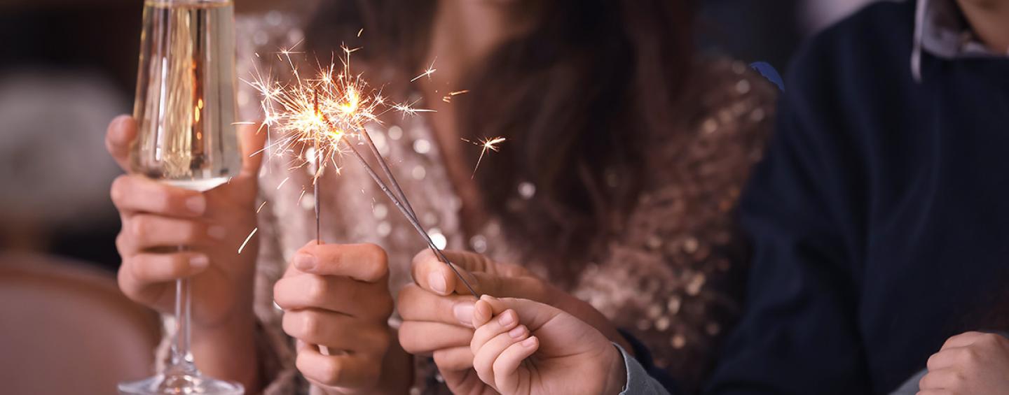 Champagne glass and fireworks