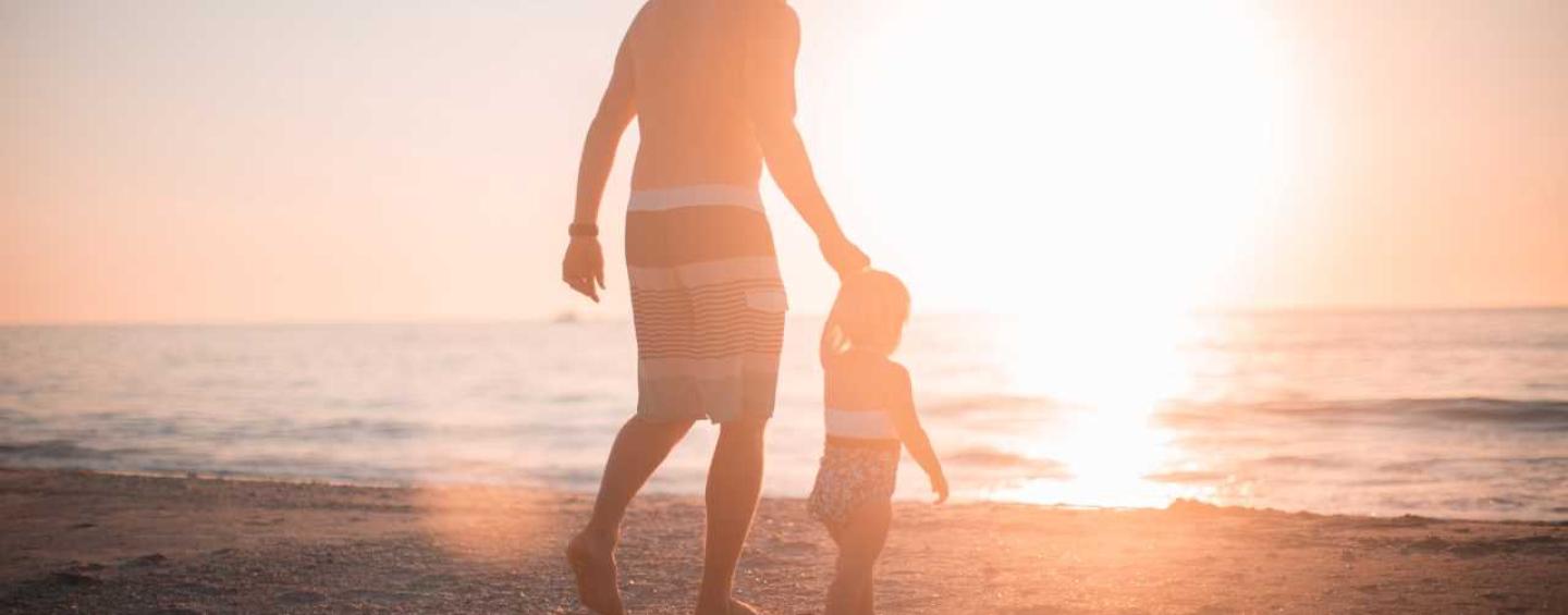 Father and daughter on beach