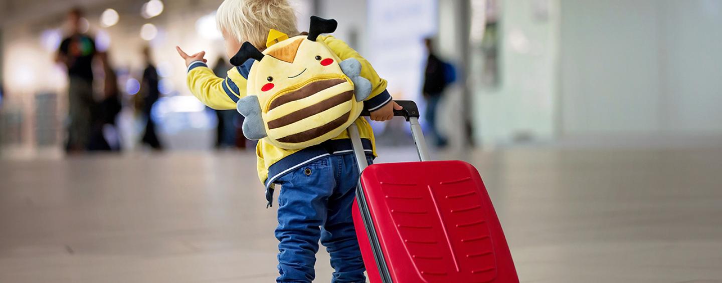 Child with luggage at the ariport