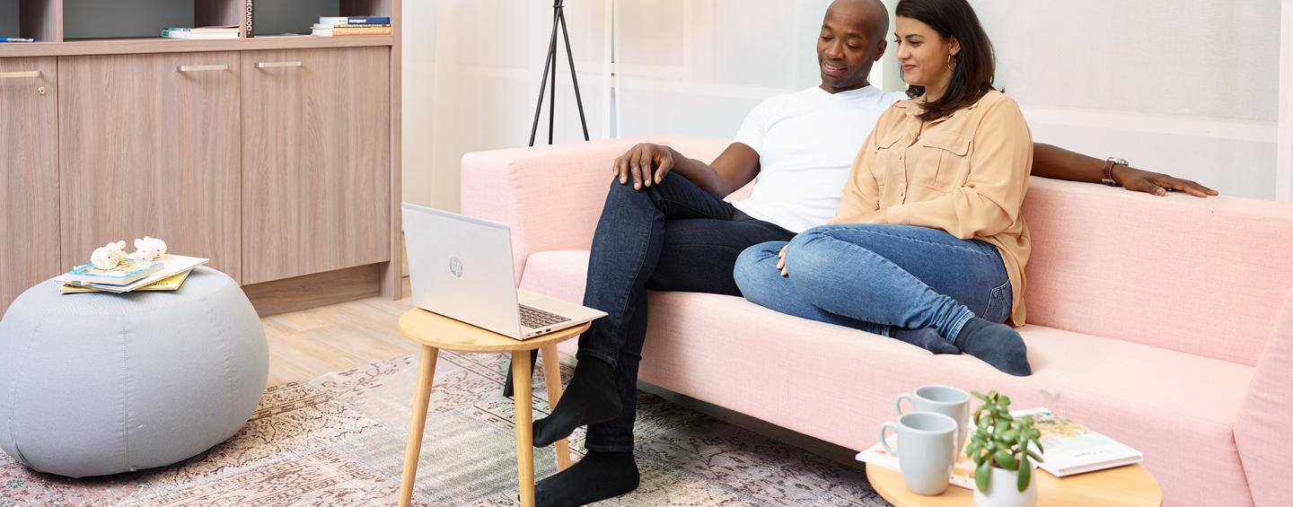 A couple watching a webinar