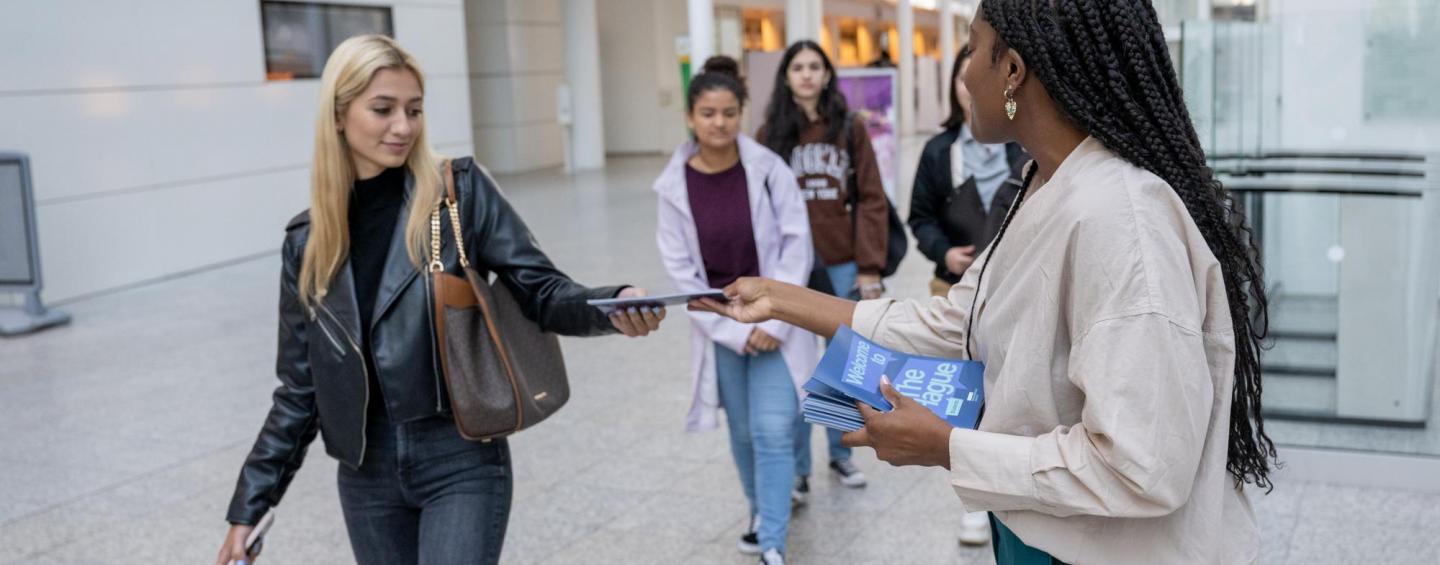 giving out student guides