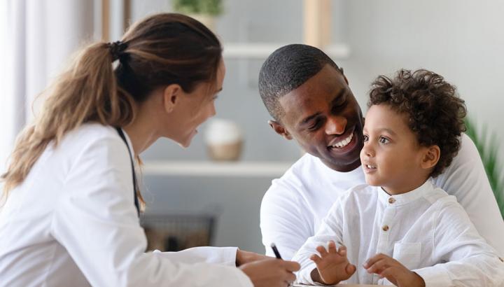 Doctor with father and child